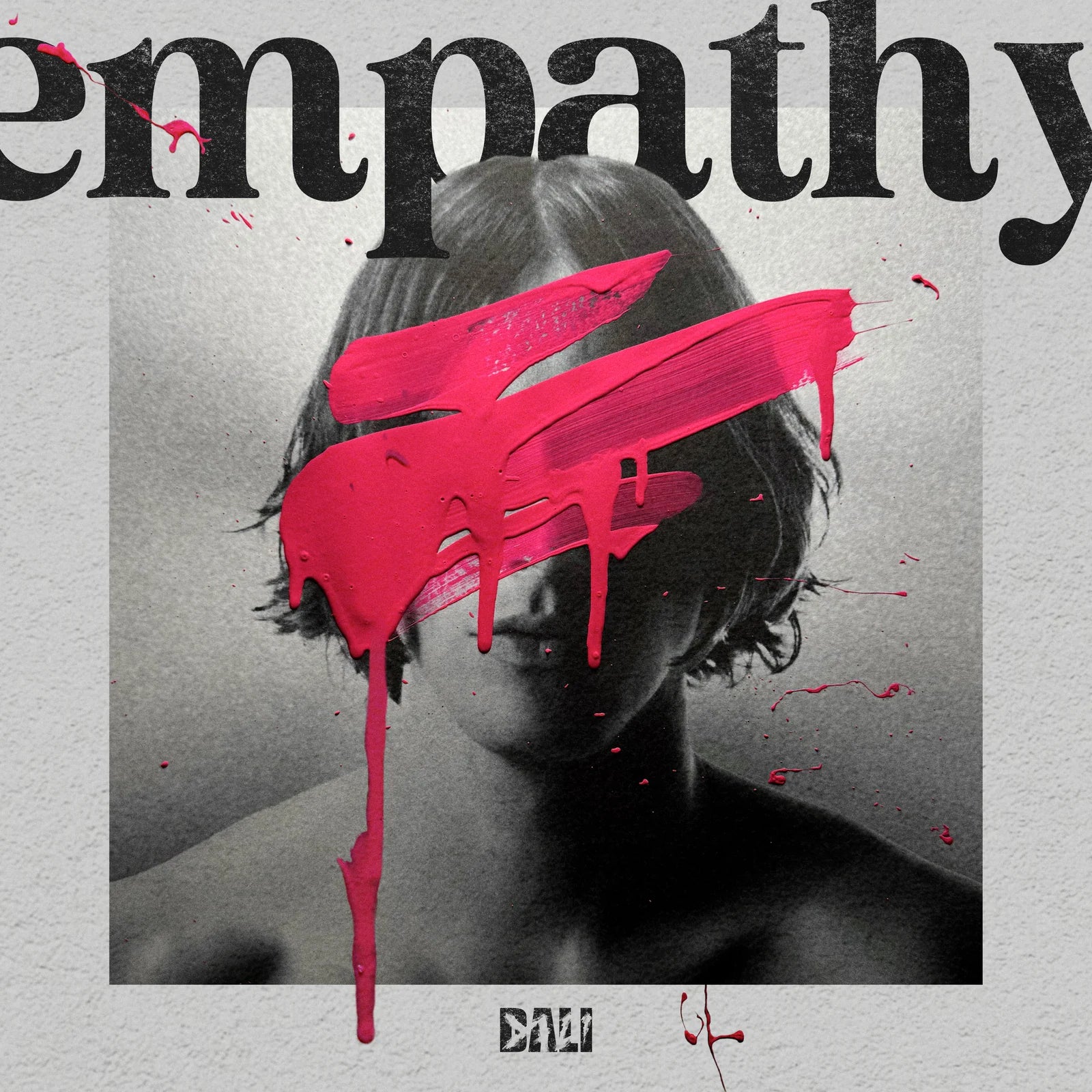 Empathy — a monochrome portrait crossed by vivid pink paint